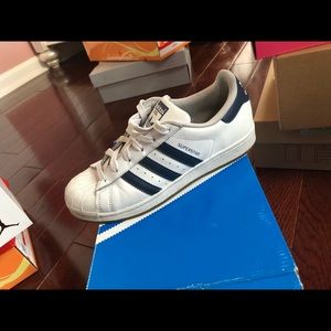 White Adidas Superstar with Navy Blue